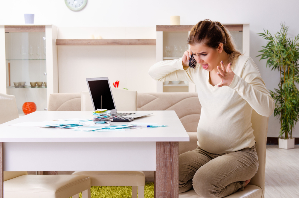 Pregnant woman angry at computer