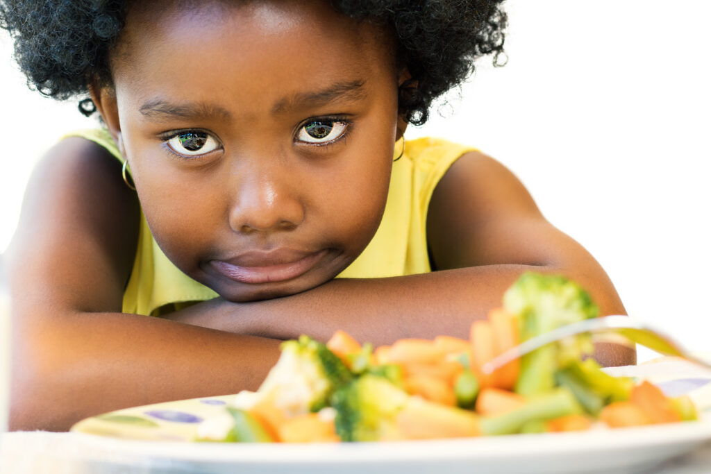 Young girl doesn't want veggies